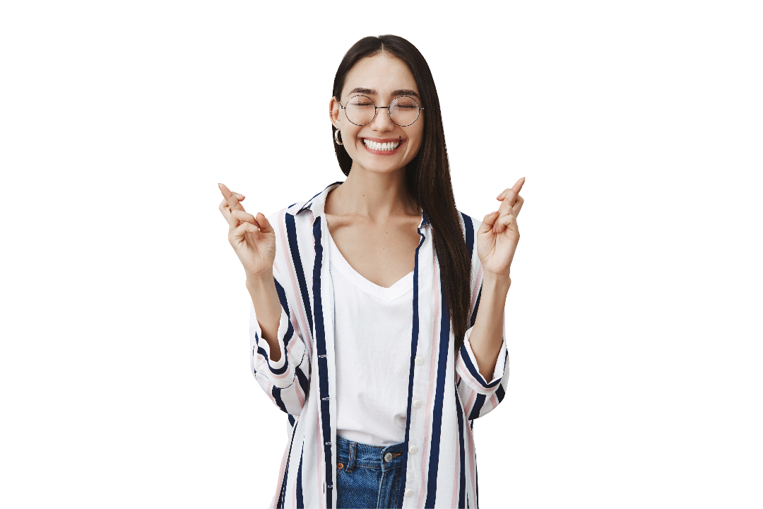 joyful-happy-carefree-woman-glasses-striped-blouse-smiling-joyfully-with-closed-eyes-being-dreamy-thrilled-while-raising-hands-with-crossed-fingers-making-wish